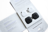 A pack of four Tile Mate devices in black and white, displayed in an organised, branded packaging. A pack of four Tile Mate devices in black and white, displayed in an organised, branded packaging.