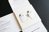 A pack of two white Tile Pro tracking devices displayed in a branded presentation box. A pack of two white Tile Pro tracking devices displayed in a branded presentation box.