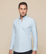 A light blue button-up shirt with a collar, featuring long sleeves and a logo on the upper chest.