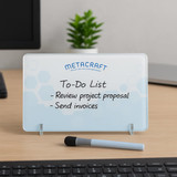 A whiteboard desk sign in light blue with a black marker, featuring a to-do list in black writing. A whiteboard desk sign in light blue with a black marker, featuring a to-do list in black writing.