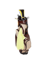 A bamboo golf towel in bright yellow, attached to a brown and beige golf bag, featuring a plastic hook.