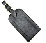 A black leather luggage tag with a buckle strap and a textured surface for personalisation. A black leather luggage tag with a buckle strap and a textured surface for personalisation.