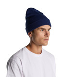 A navy cuff beanie worn by a person, featuring a ribbed texture and a logo.