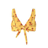 A yellow bikini top with a tied front, featuring a palm tree and beach view design. It has adjustable straps and a logo.