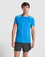 A blue T-shirt with yellow accents, worn by a model, features short sleeves and a logo.