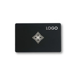 A black card featuring a decorative silver design in the centre and a logo on the top right corner.