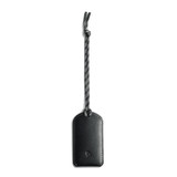 A black luggage tag made of leather, featuring a braided attachment. It has a logo on its surface.