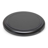 A round, black wireless charger with a smooth surface and a port on the side. A round, black wireless charger with a smooth surface and a port on the side.