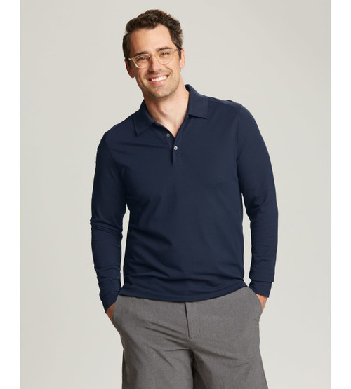 A man wearing a navy CB DryTec Long Sleeve Advantage Polo with a collar, featuring a logo. A man wearing a navy CB DryTec Long Sleeve Advantage Polo with a collar, featuring a logo.