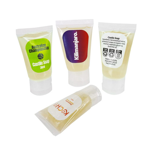 Four transparent 30ml tubes of Castile soap, featuring a mix of yellow soap inside and different branding. Four transparent 30ml tubes of Castile soap, featuring a mix of yellow soap inside and different branding.