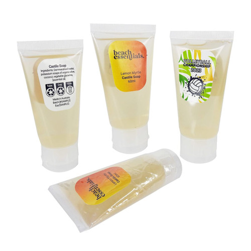Four transparent tubes of Castile soap, featuring yellow liquid soap inside. Each tube has a label and a logo. Four transparent tubes of Castile soap, featuring yellow liquid soap inside. Each tube has a label and a logo.