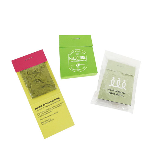 Three packaging pouches of Organic Matcha Green Tea, featuring green, pink, and yellow colours, with branding on each. Three packaging pouches of Organic Matcha Green Tea, featuring green, pink, and yellow colours, with branding on each.