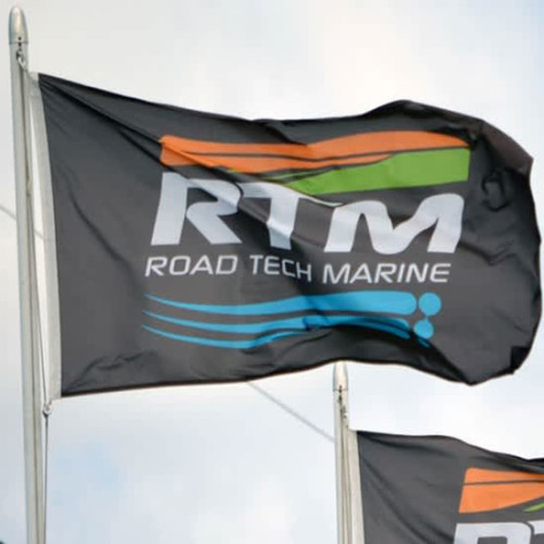 A double-sided custom printed flag with a black background and a logo featuring orange and teal elements. A double-sided custom printed flag with a black background and a logo featuring orange and teal elements.