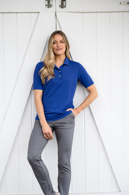 A blue ladies' polo shirt with short sleeves, a collar, and three buttons. It features a logo on the chest area.