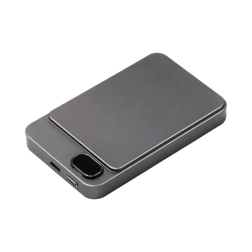A grey magnetic wireless power bank with a sleek design and a small logo on the surface.