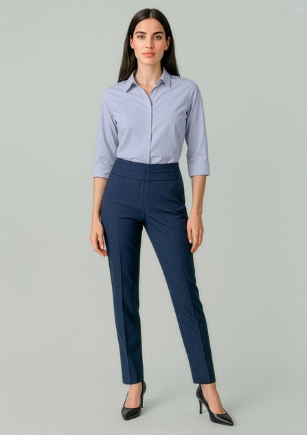 A pair of women's mid-waist slim leg pants in navy blue, featuring a sleek design. The model wears a light blue shirt and heels.