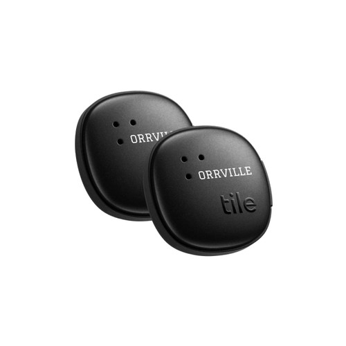 Two black Tile stickers in a 2 pack with small holes, featuring a logo on one of the stickers. Two black Tile stickers in a 2 pack with small holes, featuring a logo on one of the stickers.