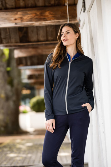 A navy full zip hoodie on a model, featuring a light zipper and a casual, comfortable design. A navy full zip hoodie on a model, featuring a light zipper and a casual, comfortable design.