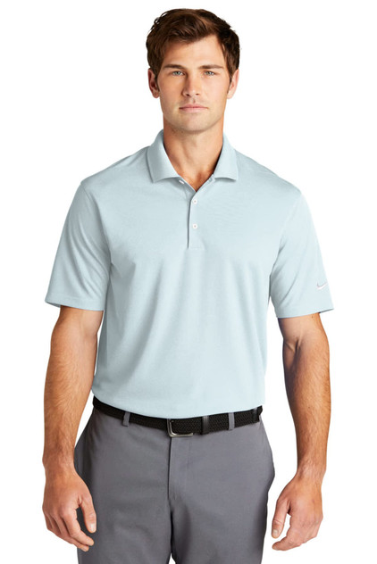 A light blue polo shirt with a collar, featuring short sleeves and a logo on the chest. A light blue polo shirt with a collar, featuring short sleeves and a logo on the chest.