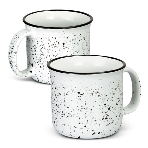 A ceramic mug in white with black speckles, featuring a simple handle and a black rim. Two mugs are displayed.