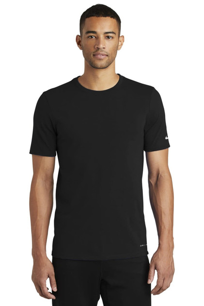 A black Nike Dri-FIT cotton/polyester t-shirt displayed on a model, featuring short sleeves and a logo. A black Nike Dri-FIT cotton/polyester t-shirt displayed on a model, featuring short sleeves and a logo.