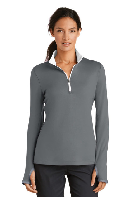 A grey ladies' 1/2-zip cover-up featuring long sleeves and a white collar, with branding visible.