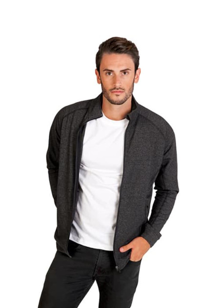 A man models a black heather jacket with a zip front, paired with a plain white T-shirt. The jacket features a logo. A man models a black heather jacket with a zip front, paired with a plain white T-shirt. The jacket features a logo.