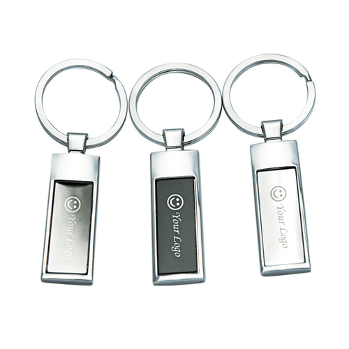 A set of three silver keyrings, featuring rectangular designs and a smooth finish, with branding on each.