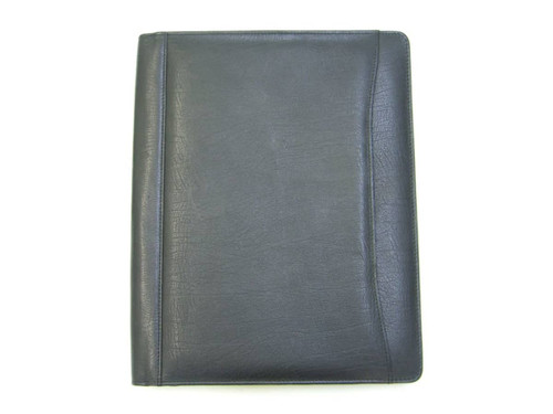 A4 leather compendium in black with a textured finish and a subtle logo on the cover. A4 leather compendium in black with a textured finish and a subtle logo on the cover.