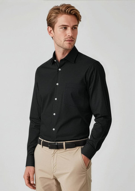 A black long sleeve button-up shirt worn by a model, featuring a sleek design and a collar, paired with beige trousers.