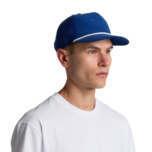 A blue corduroy cap featuring a flat brim and an understated design, including a logo on the front.