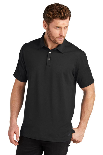 A black polo shirt with a collar and a logo. It has short sleeves and a relaxed fit.