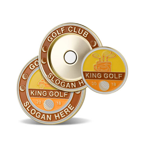 Three circular soft enamel magnetic ball markers in gold, orange, and brown featuring golf-themed designs and a logo.