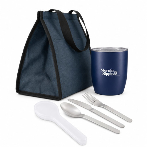 A blue drink tumbler, silver utensils, and a navy lunch bag arranged together. The bag features black handles.