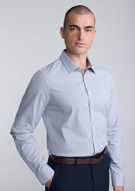 A slim fit long sleeve shirt in a light blue check pattern, worn by a model with a shaved head.