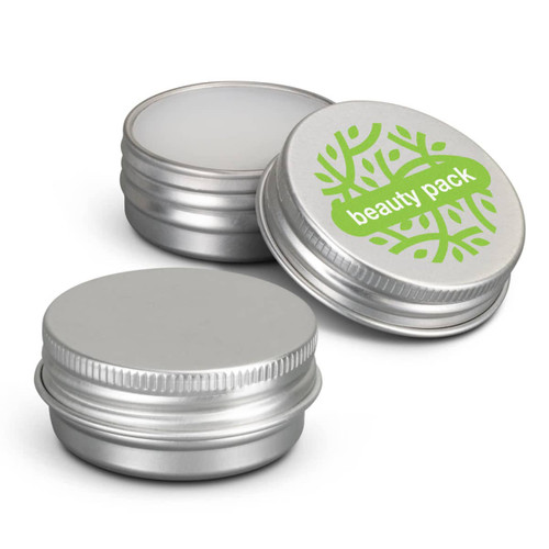A silver lip balm tin with a smooth surface and one featuring a green logo. Three tins are pictured. A silver lip balm tin with a smooth surface and one featuring a green logo. Three tins are pictured.