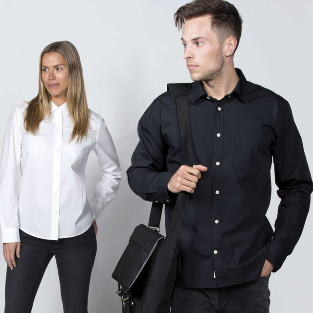 A woman in a white button-up shirt and a man in a black button-up shirt, both with stylish poses.