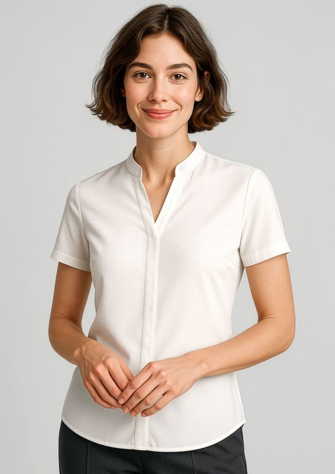 A short sleeve women's blouse in white, featuring a v-neckline and a fitted design. Includes a logo on the garment.