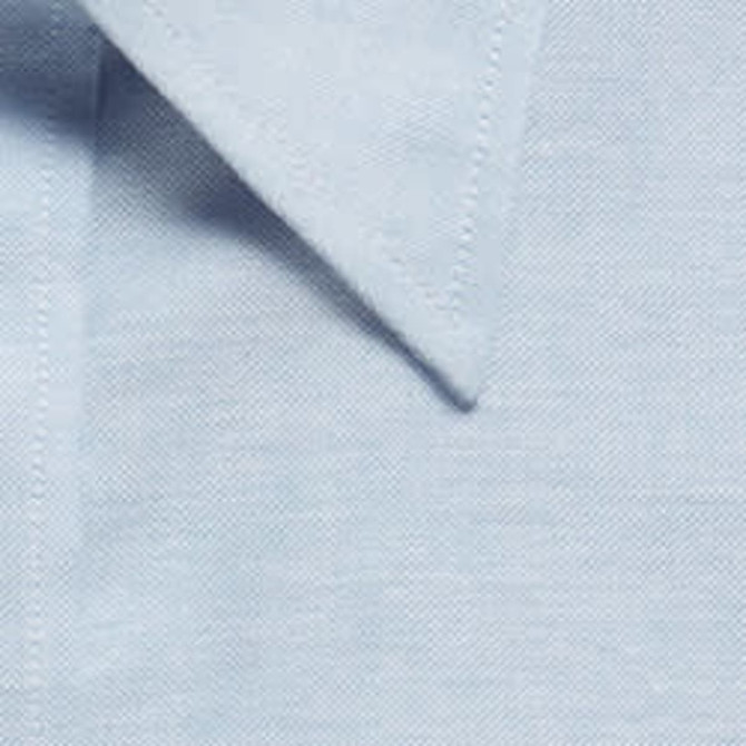 A light blue button-up shirt featuring a collar and a fabric texture. It has a logo on it.