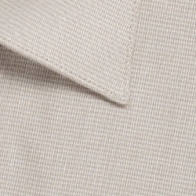 A close-up of a button-up shirt featuring a light beige puppytooth pattern with a collar.