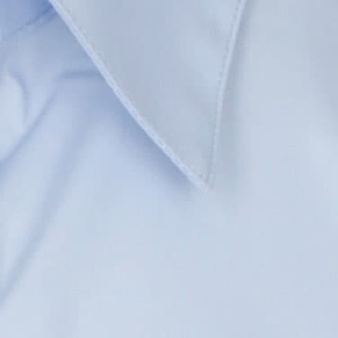 A light blue button-up shirt featuring a classic collar and smooth fabric. It includes a logo detail.