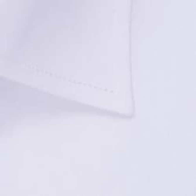 A close-up of a white button-up shirt featuring a crisp collar and stitching details. The shirt has a logo.
