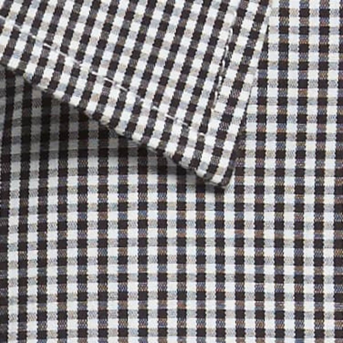 A close-up of a button-up shirt featuring a black and white gingham pattern with a folded collar. The shirt has a logo.
