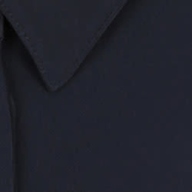 A navy blue shirt featuring a half placket and a collar, with a logo present on the fabric.