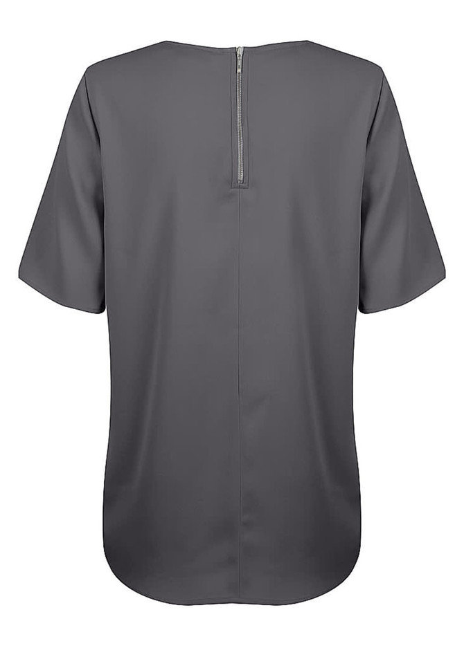 A grey short sleeve shirt with a back zip and a rounded hem, featuring a subtle branding logo.