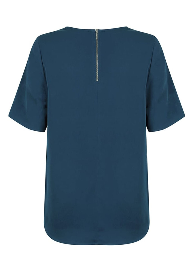 A short-sleeve shirt in a deep teal colour featuring a back zip closure and a rounded hem. It has a logo on it.
