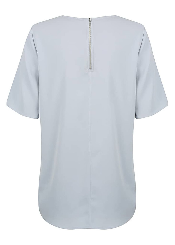 A light blue short sleeve shirt featuring a back zip closure and a simple design. It has a logo on it.