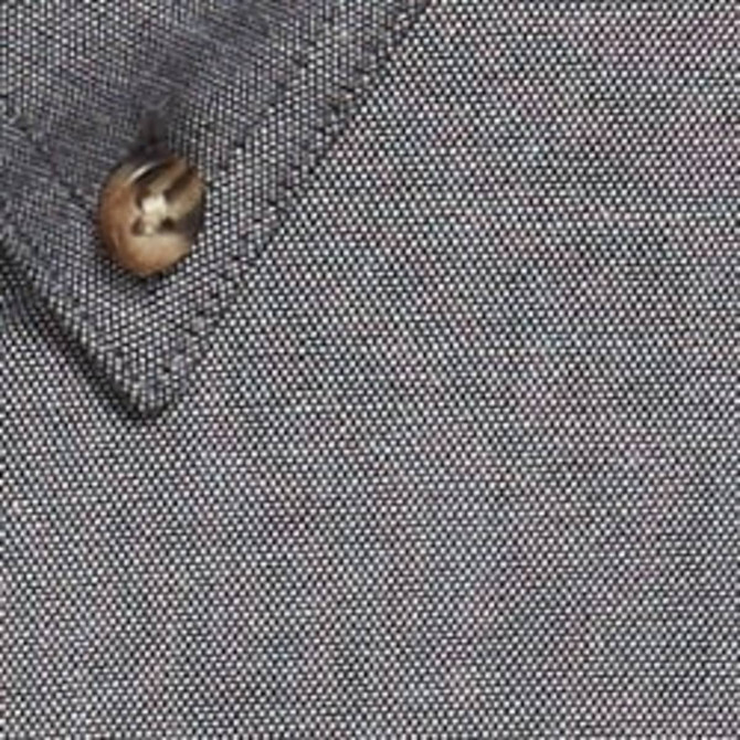 A work shirt in a grey speckled fabric featuring a button on the collar.