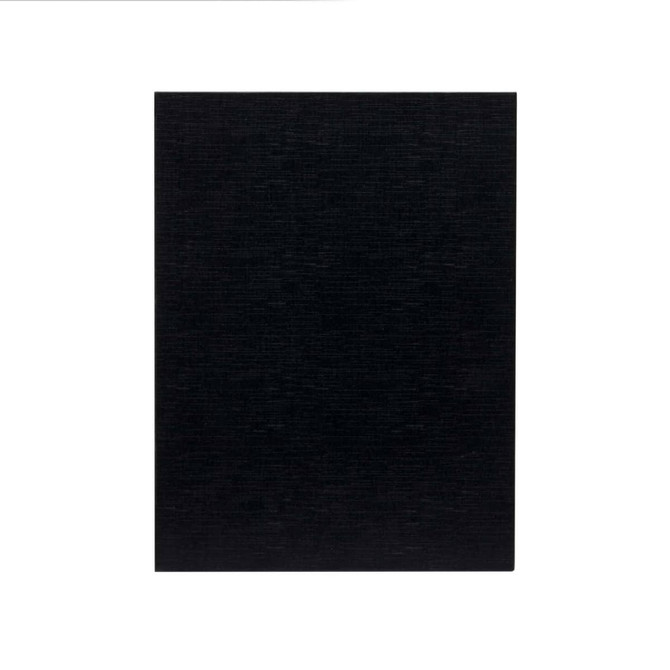 A black cheese board with a textured surface, featuring an integrated logo. Suitable for serving cheese and accompaniments.