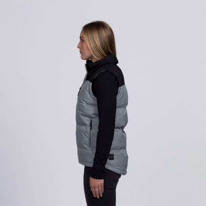 A grey and black puffa vest with a high collar, featuring a branding logo, viewed from the side.